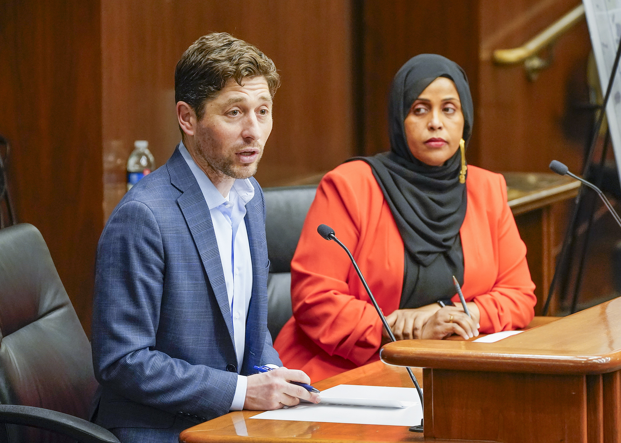 Minneapolis Mayor Jacob Frey testifies before the House Housing Finance and Policy Committee April 3 in support of a bill sponsored by Rep. Hodan Hassan, right, that would provide $35 million in affordable housing funding. (Photo by Andrew VonBank)